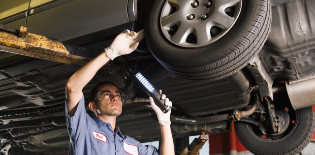 ASE certified technician inspecting a vehicle on the lift at Great Valley Automotive in Malvern, PA